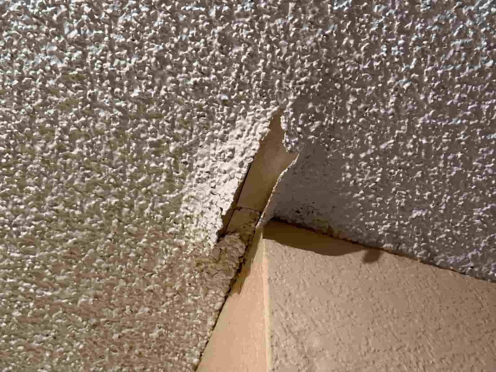 Sagging drywall ceiling overhead in a San Diego home, about to be repaired
